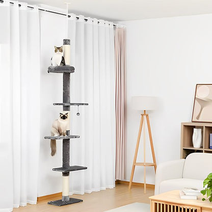 Arbre à chat vertical avec plusieurs plateformes et poteaux griffoirs installé dans un salon lumineux

